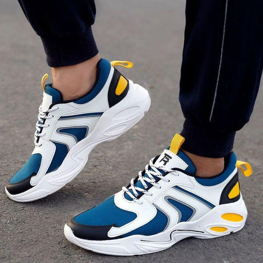 Sleek Men's Casual Sneakers
This image showcases a pair of vibrant, sporty sneakers with a sleek, modern design. The shoes feature a combination of white, navy blue, and yellow accents, creating a stylish and eye-catching look. The sneakers appear to be well-cushioned and suitable for casual wear, providing comfort and support for the wearer.