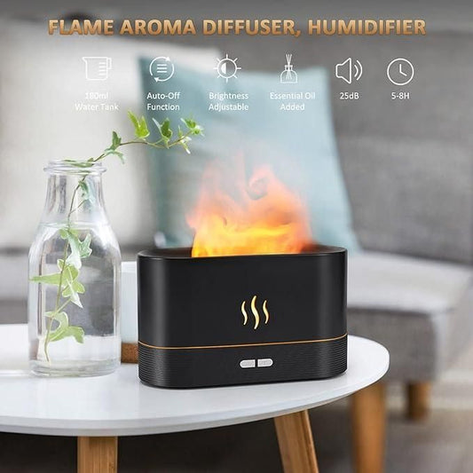 Flame aroma diffuser and humidifier with adjustable brightness and essential oil tray, placed on a white table with a decorative plant in the background.